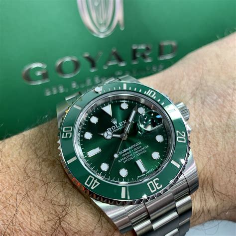 rolex with a green dial